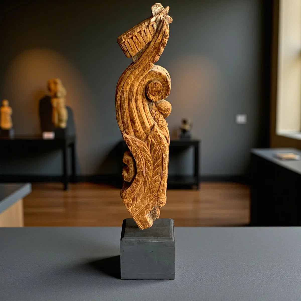 How can I decorate with an antique wooden bracket?