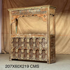 Carved Bar Counter — Stud Door & Floral Canopy
