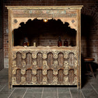 Carved Bar Counter — Stud Door & Floral Canopy