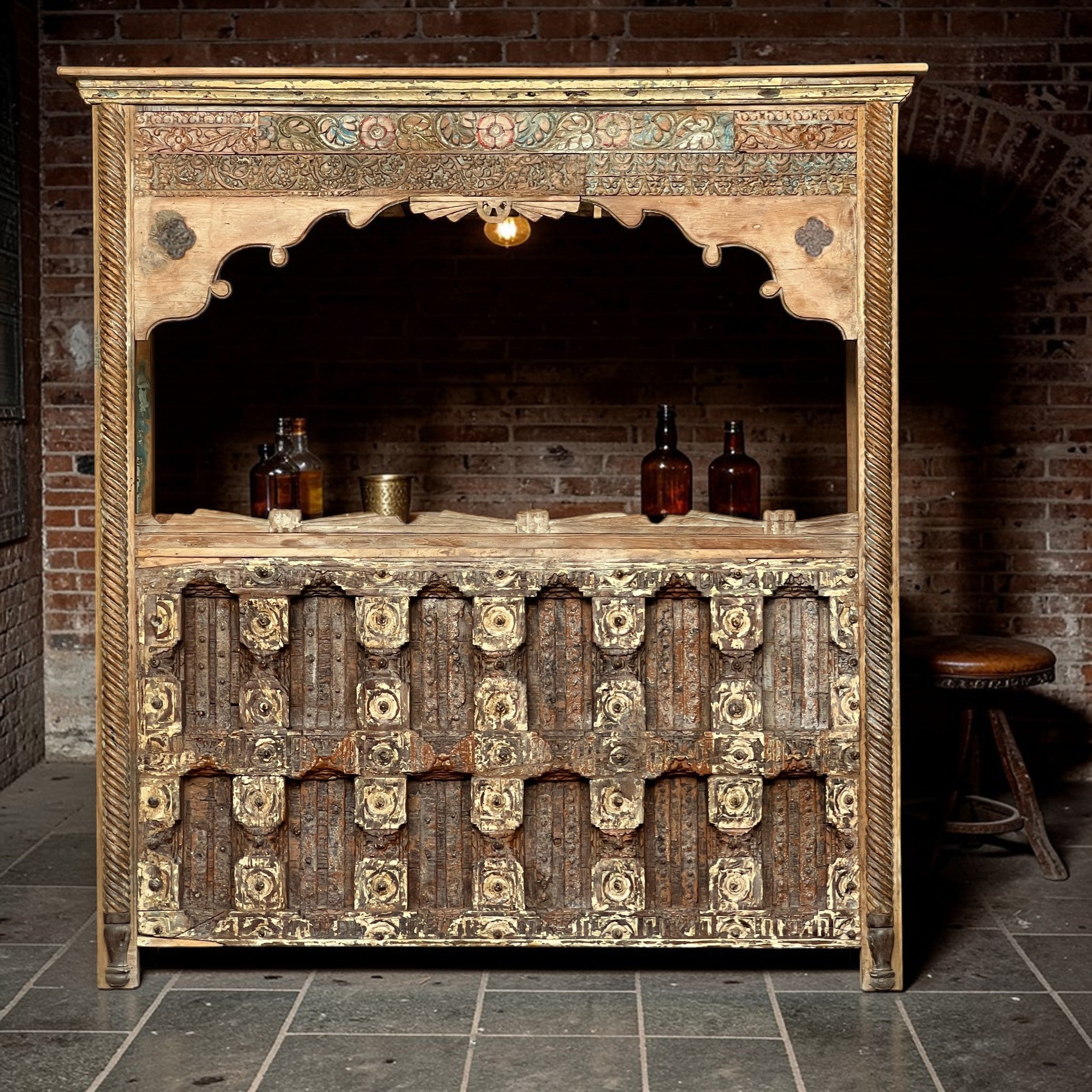 Carved Bar Counter — Stud Door & Floral Canopy